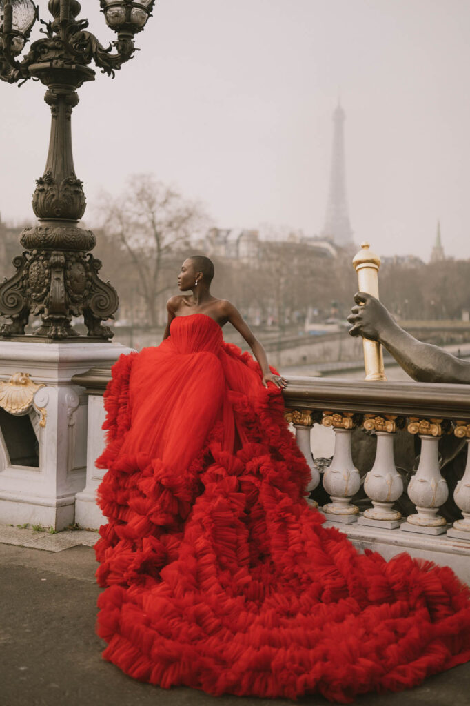 Red luxury dress in Paris: rich red color choice for photoshoot