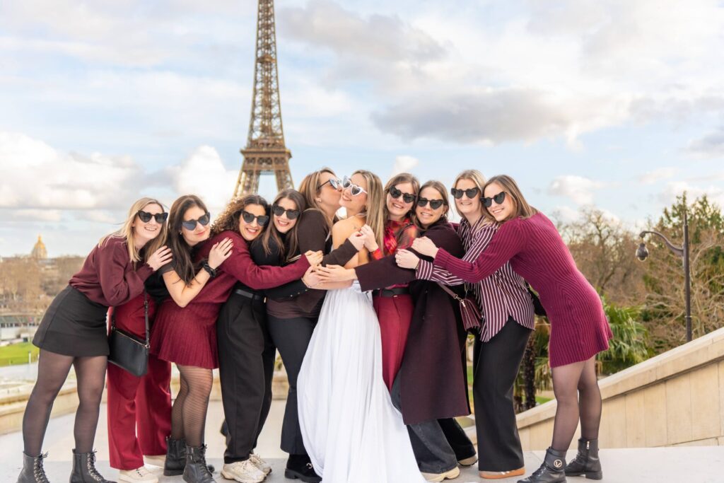 Paris Group Photoshoot for friends at Trocadéro with Eiffel Tower, group hugging and smiling