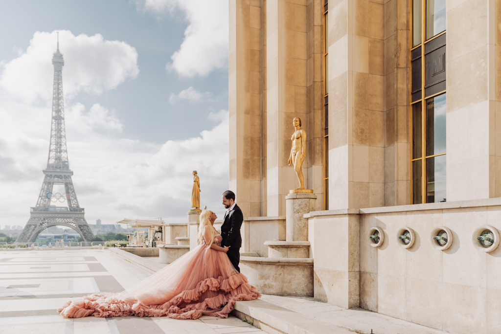 Romantic Paris photoshoot at sunrise near the Eiffel Tower, couple in formalwear and pink gown