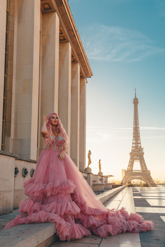 Eiffel Tower photoshoot at sunrise from Trocadéro, woman in a pink gown on an empty terrace