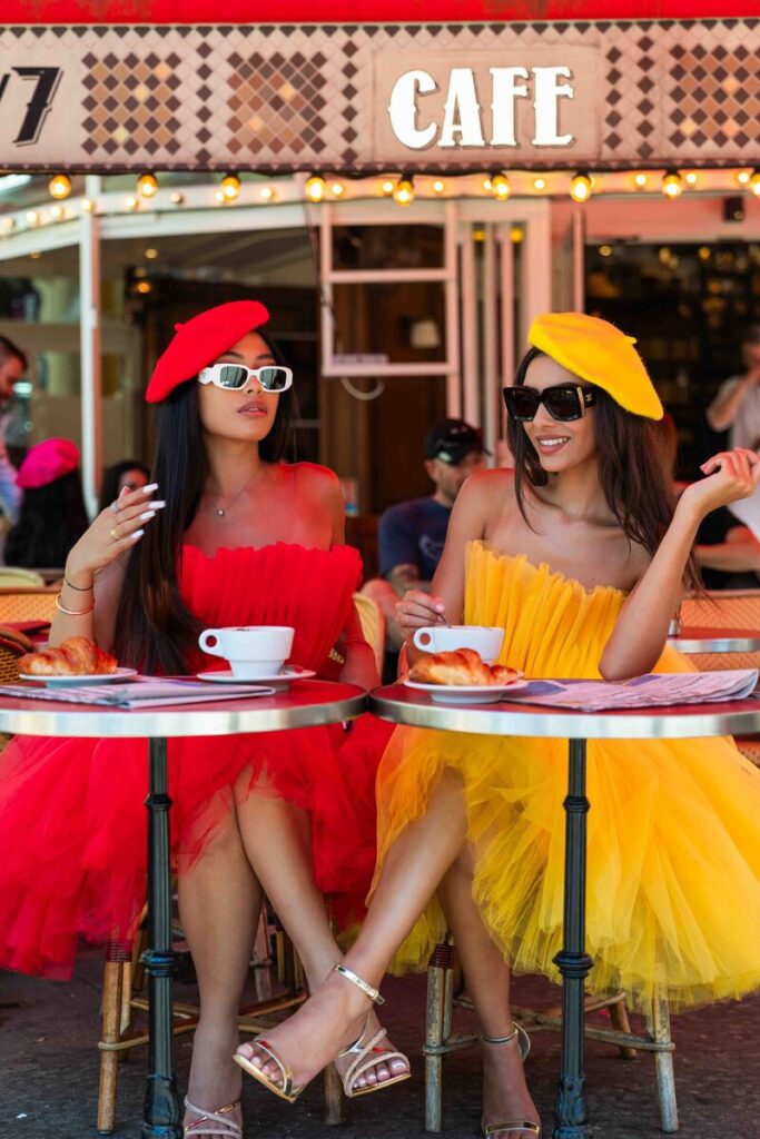 Bachelorette Photoshoot Paris café moment with berets, sunglasses, and colorful dresses
