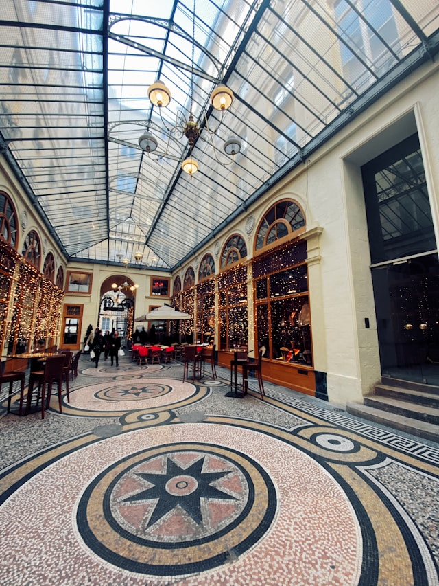 Galerie Vivienne covered passage Paris photoshoot location with elegant glass roof and mosaic floor