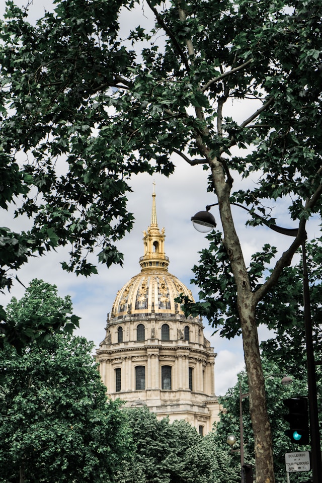 Les Invalides golden dome Paris photoshoot location framed by trees